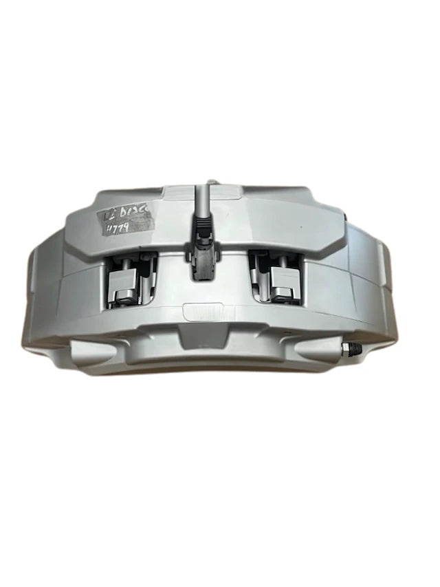 Brake Caliper Front Right by Roverland Parts in silver with mounting components visible