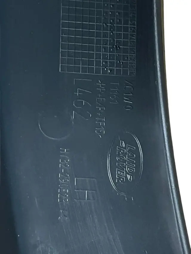 Roverland Parts black plastic Land Rover branded Fender Flare Left Rear with part markings