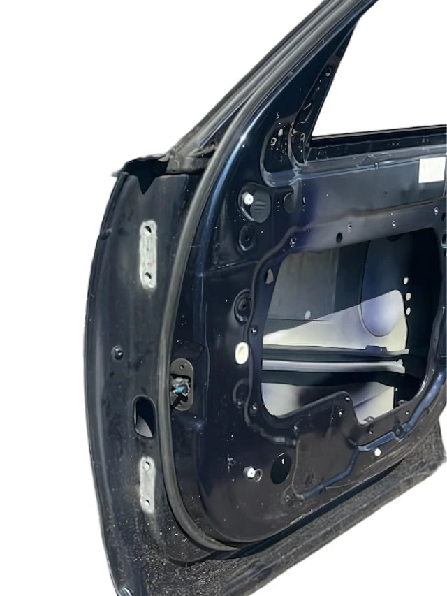 Black metal frame of a Roverland Parts front door without exterior panel showing internal structure