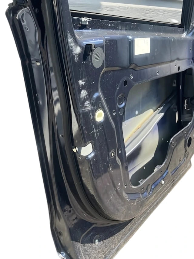 Roverland Parts black front door inner panel without upholstery showing hardware and structure