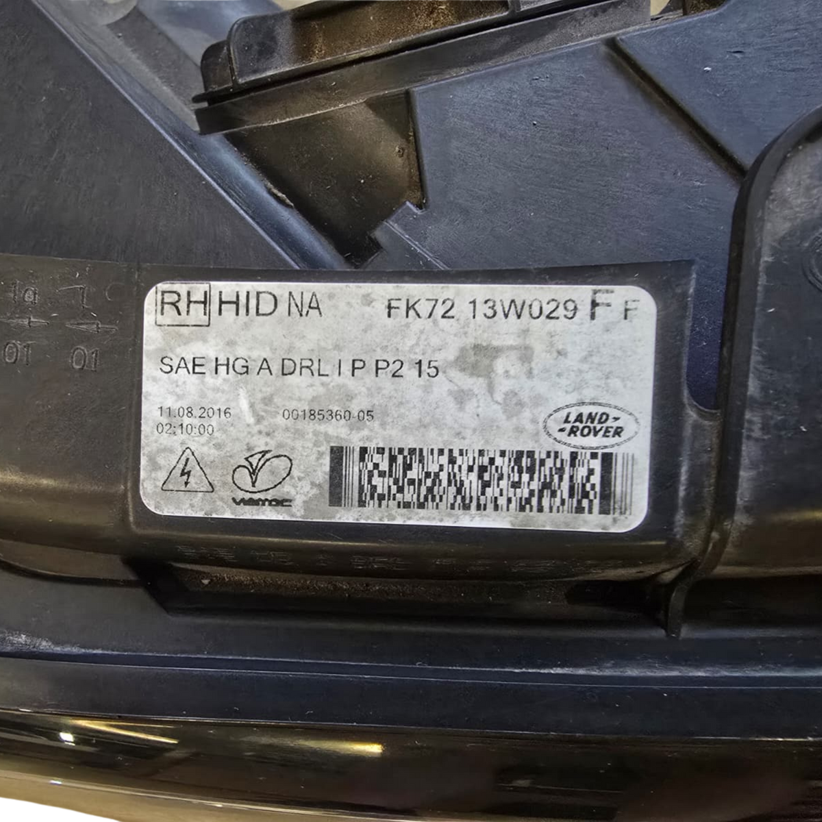 Roverland Parts Land Rover headlight component label with specifications and manufacturing details