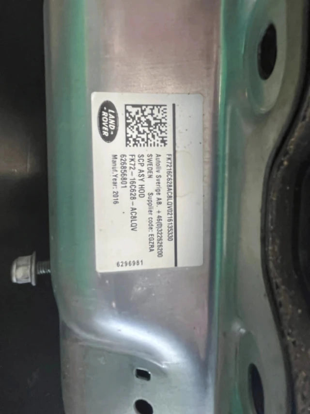 Land Rover hood metal panel with label sticker and bolt showing part area Hood Cowl Or Vent for repair