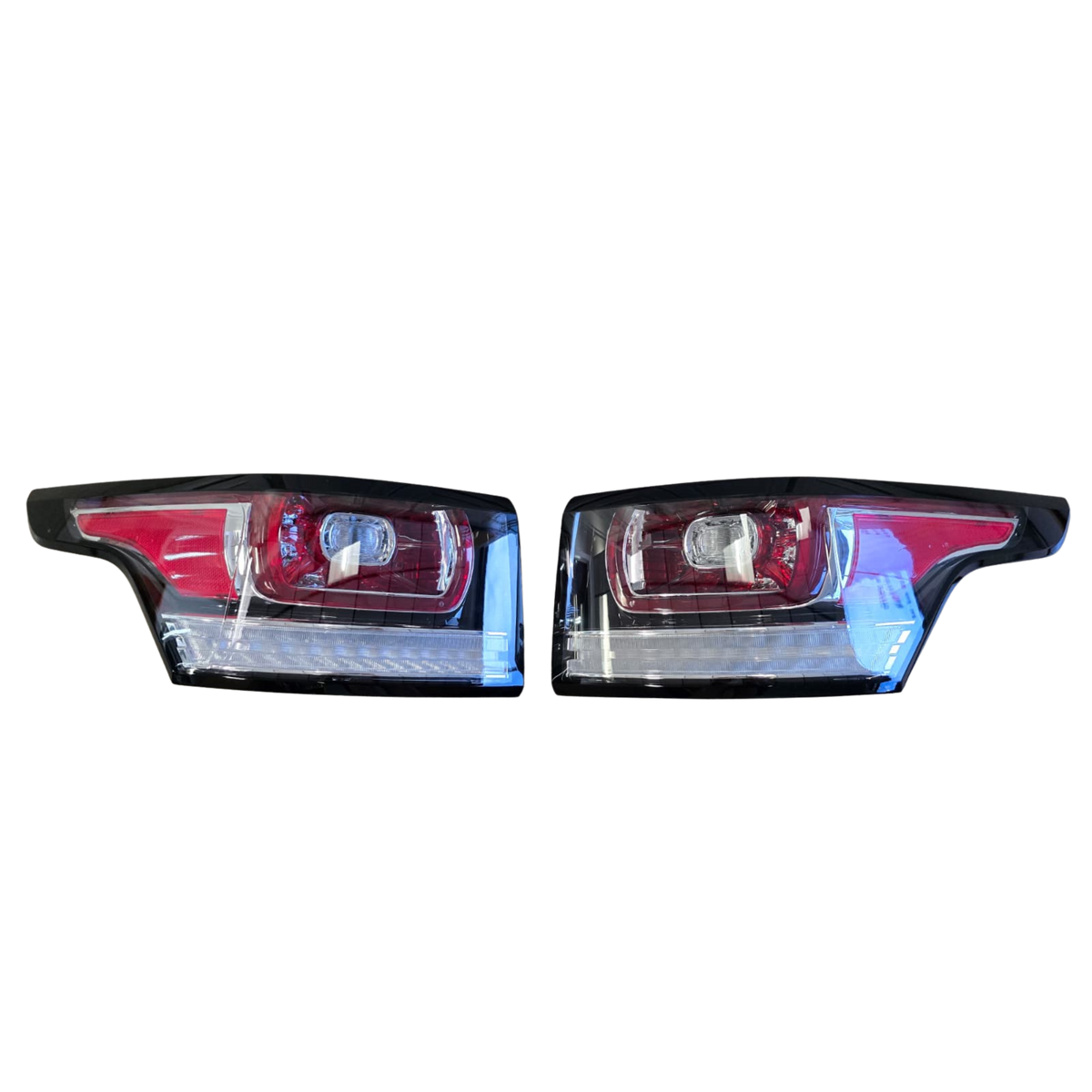 Roverland Parts Tail Light set with clear lenses and red housing for enhanced vehicle visibility