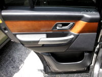 Range Rover Door Trim Panel in black and brown with integrated handle and storage compartment