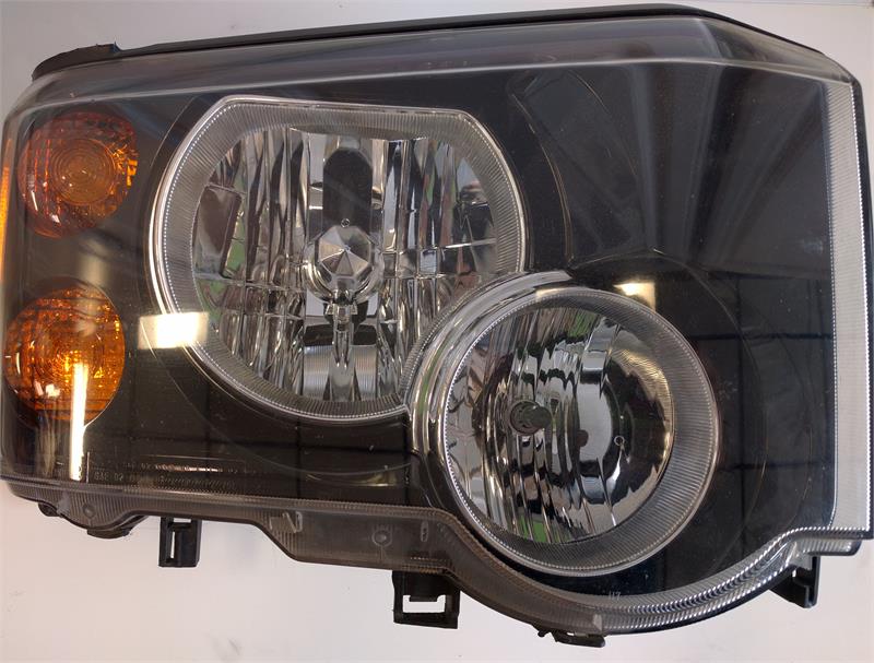Discovery Parts headlight assembly with clear lenses and amber turn signal sections