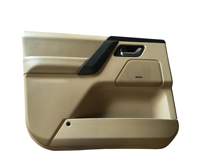 Beige LR2 Parts door panel with black handle trim and built-in speaker area