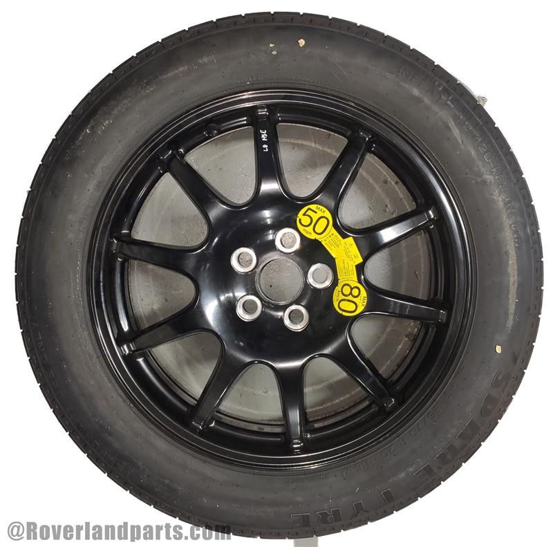 Land Rover Range Rover black alloy wheel with tire and speed limit stickers