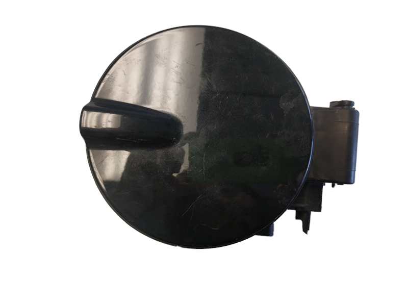 Black round fuel door for LR2 parts with attached hinge mechanism