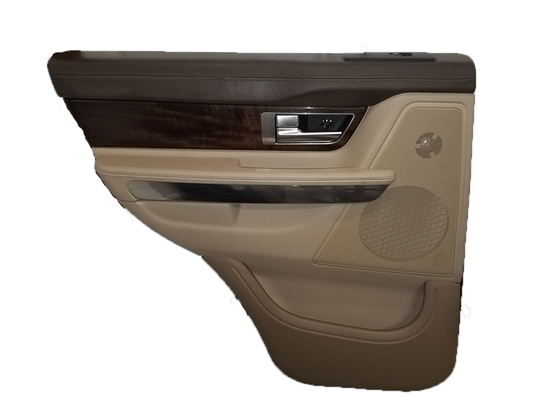 Range Rover beige and brown interior door panel with wood trim and speaker grille
