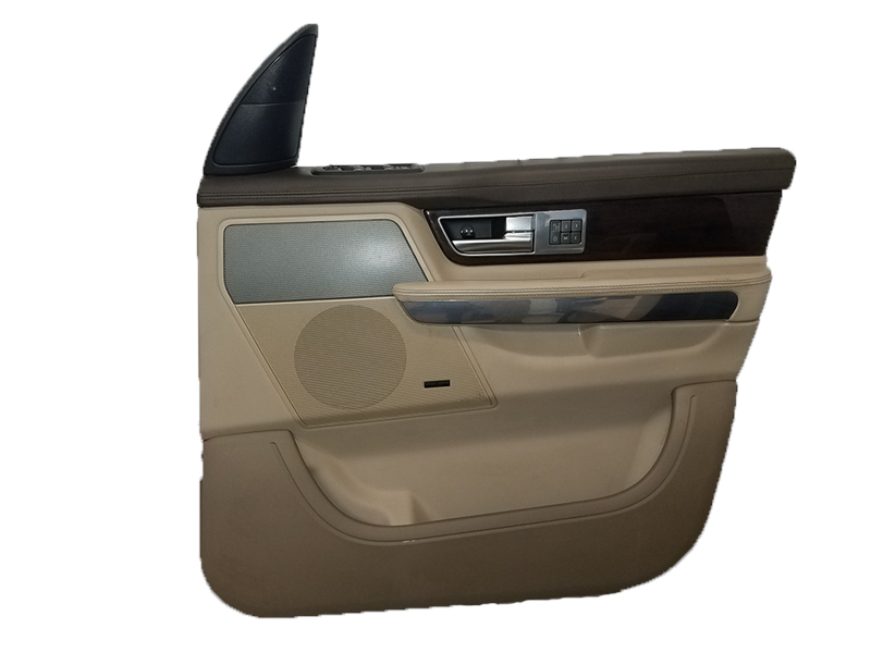 Beige and brown Range Rover door interior panel with speaker and control buttons