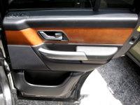 Range Rover Door Trim Panel in black and brown with silver handle and storage compartment