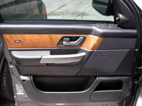 Range Rover Door Trim Panel featuring wood and leather design for luxury vehicle interior