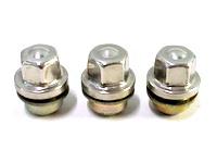 Three silver Discovery Parts lug nuts with washers arranged in a row on a white background