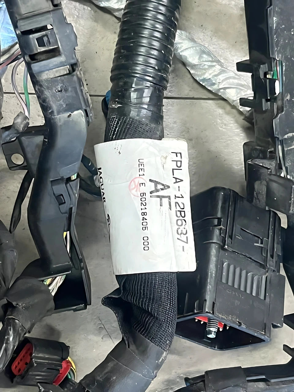 Discovery Engine Wiring Harness by Roverland Parts with protective black sheathing and connectors