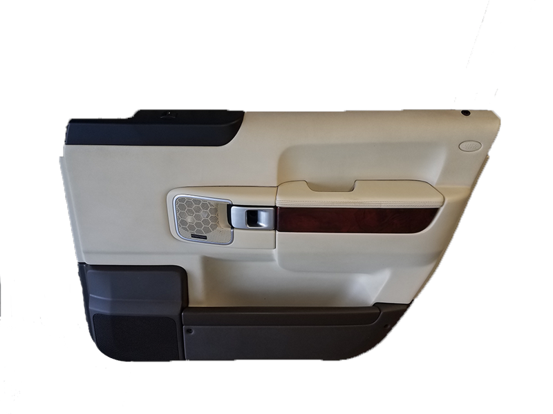 Range Rover beige door trim panel with chrome handle and wood accent for vehicle interior