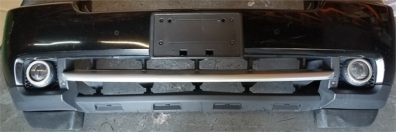 Black Range Rover front bumper with fog light housings and mounting bracket for license plate