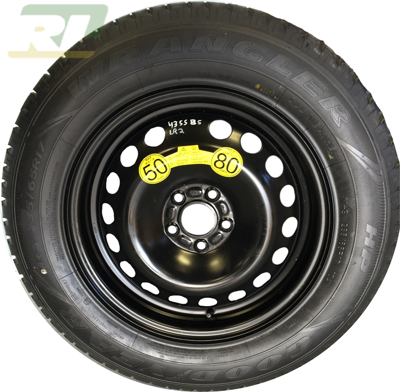 LR2 parts black steel wheel with Goodyear Wrangler tire and yellow speed limit stickers