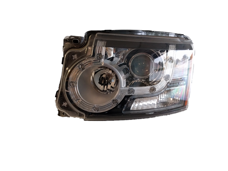 LR3 and LR4 vehicle replacement headlight with clear lens and integrated reflector design