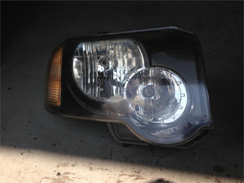 Freelander car headlight with clear lens and integrated amber turn signal light