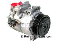 Land Rover LR3 LR4 air conditioning compressor part with black pulley and red caps