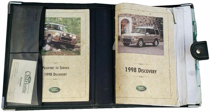 1998 Land Rover Discovery owner&#39;s manual and service passport in black leather case