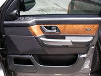 Range Rover Door Trim Panel with wood and black finish installed on car door interior