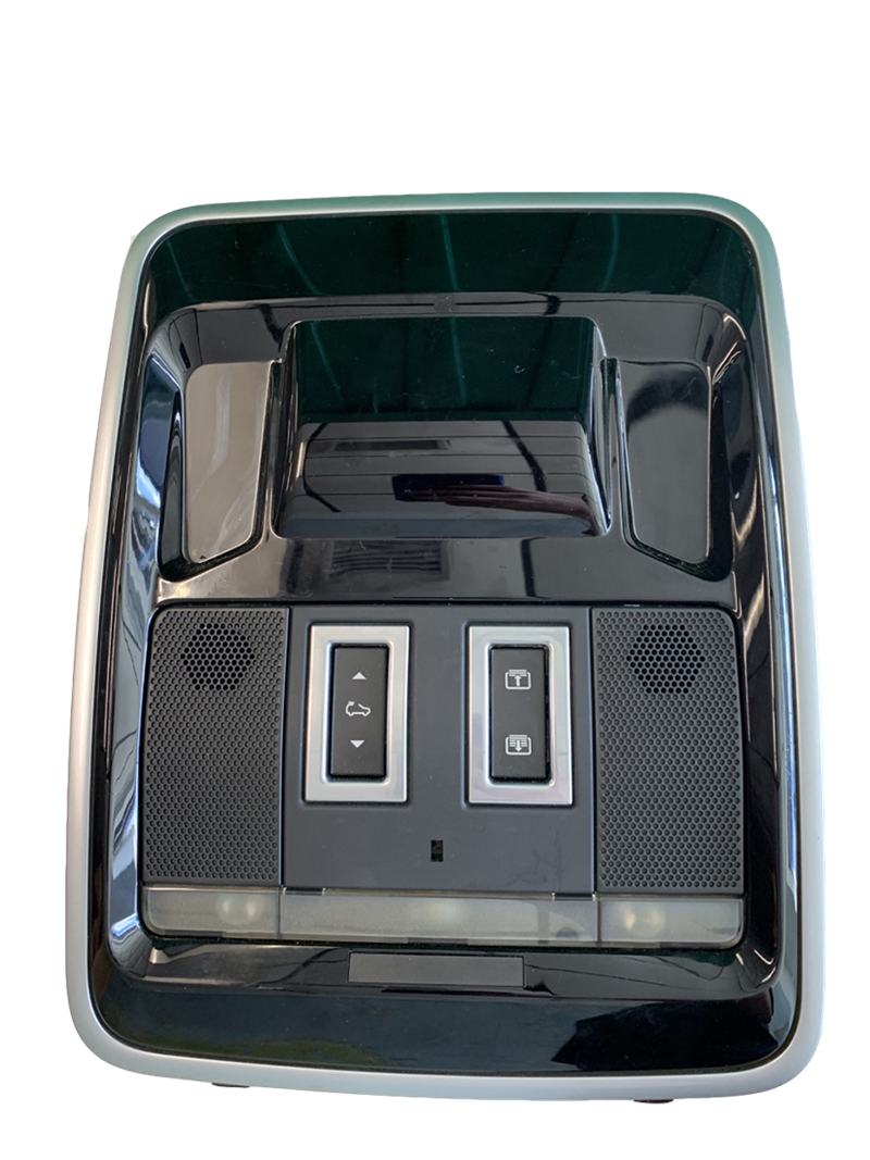 Range Rover Overhead console part with control buttons and speaker grills in black finish