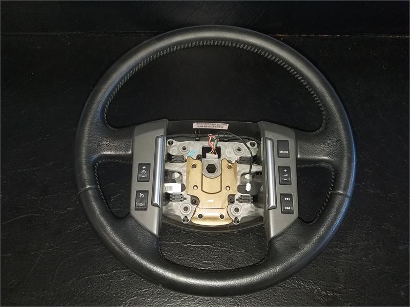 Black LR2 Parts steering wheel with radio control buttons and central mounting hardware