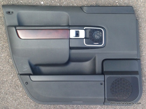 Range Rover black interior door panel with wood trim and speaker grill