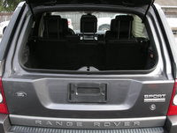 Range Rover lower tailgate in silver color showing rear vehicle view with open trunk