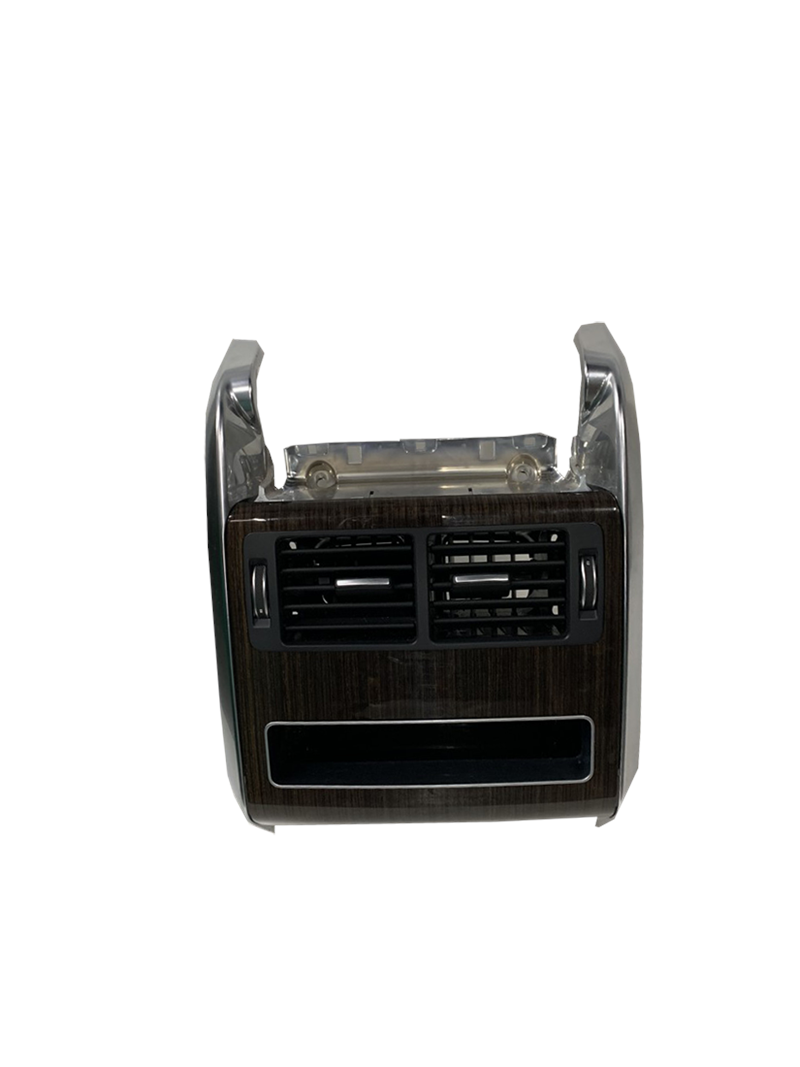 Range Rover dashboard air vent panel with wood grain finish and black vent slots