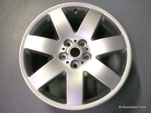 Silver alloy Range Rover Wheel with five wide spokes and central bolt holes