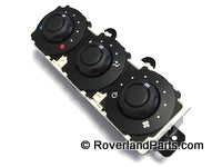 LR3 control panel with three black rotary knobs for vehicle climate and settings adjustment
