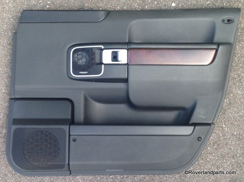 Range Rover door trim panel in black with wood accent and built-in speaker for vehicle interior