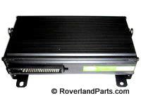 2003 Range Rover radio amplifier black rectangular unit with cooling fins and connector ports