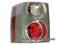 Blemished Range Rover taillight assembly with clear and red circular lenses and vertical reflector