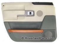 Range Rover beige and gray interior door panel with control handle and speaker