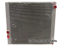 Range Rover PCC500370 radiator heat exchanger with metal fins and red inlet and outlet ports