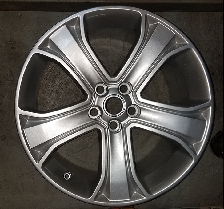 Silver Range Rover alloy wheel with five-spoke design for vehicle replacement parts