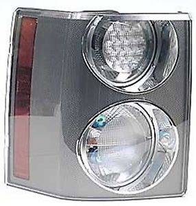 Range Rover XFB500351LPO headlight assembly with dual circular lights and red side reflector